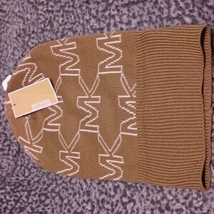 Michael Kors hat. NWT. Brown and White letters. Stylish. Flawless